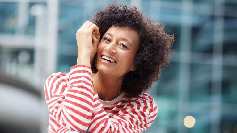 woodland hills woman smiling after getting dental implants