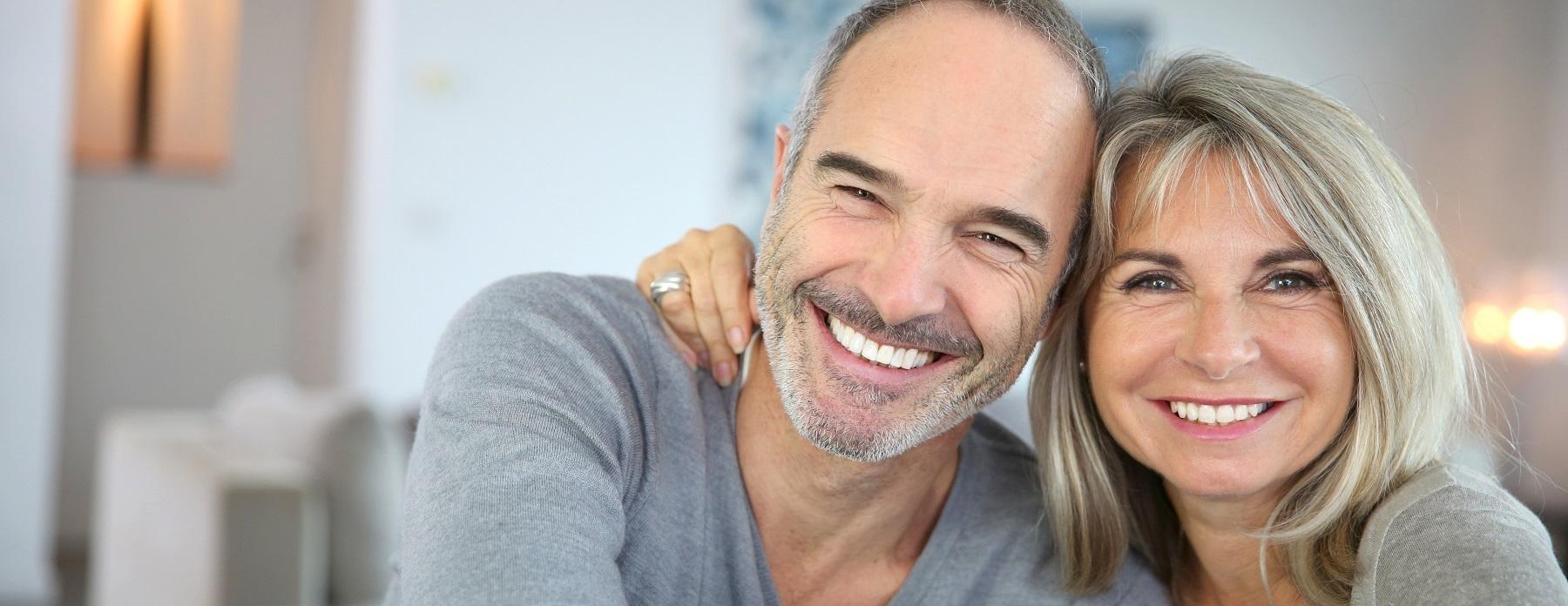 woman and man smiling 