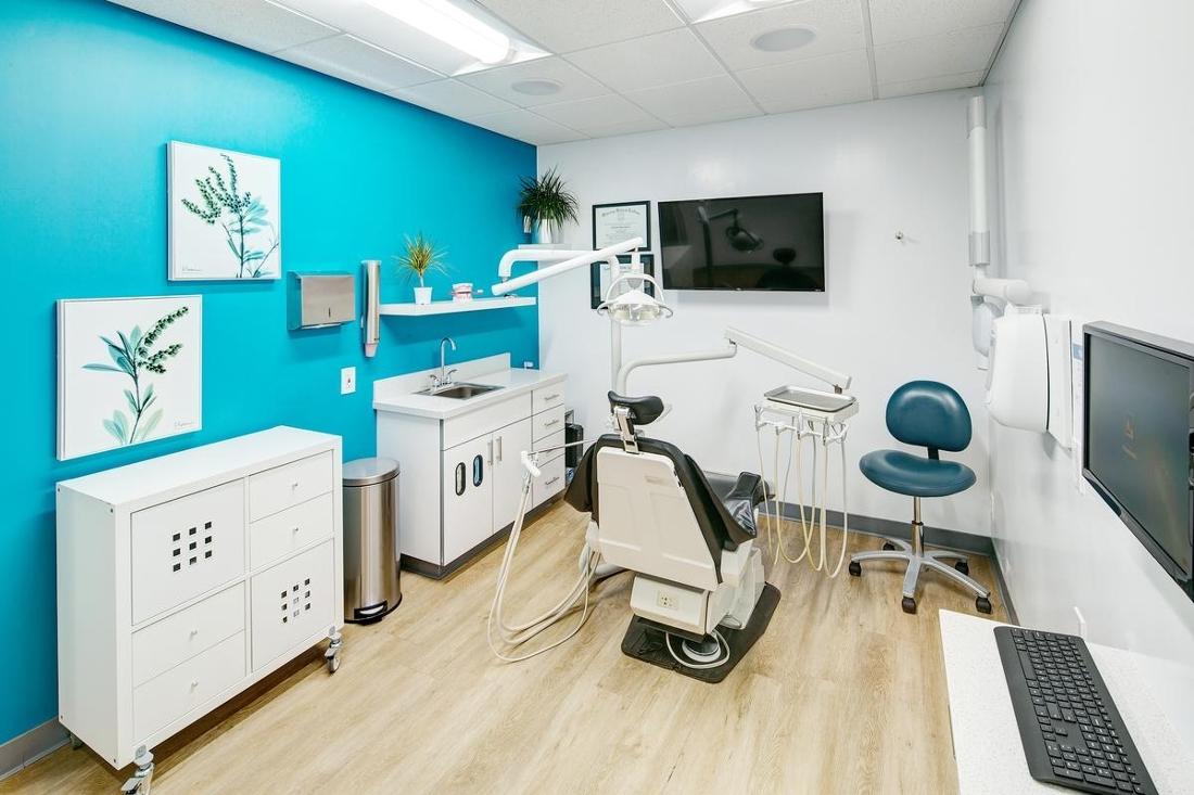 Clean and modern dental clinic room with comfortable exam chair in Woodland Hills
